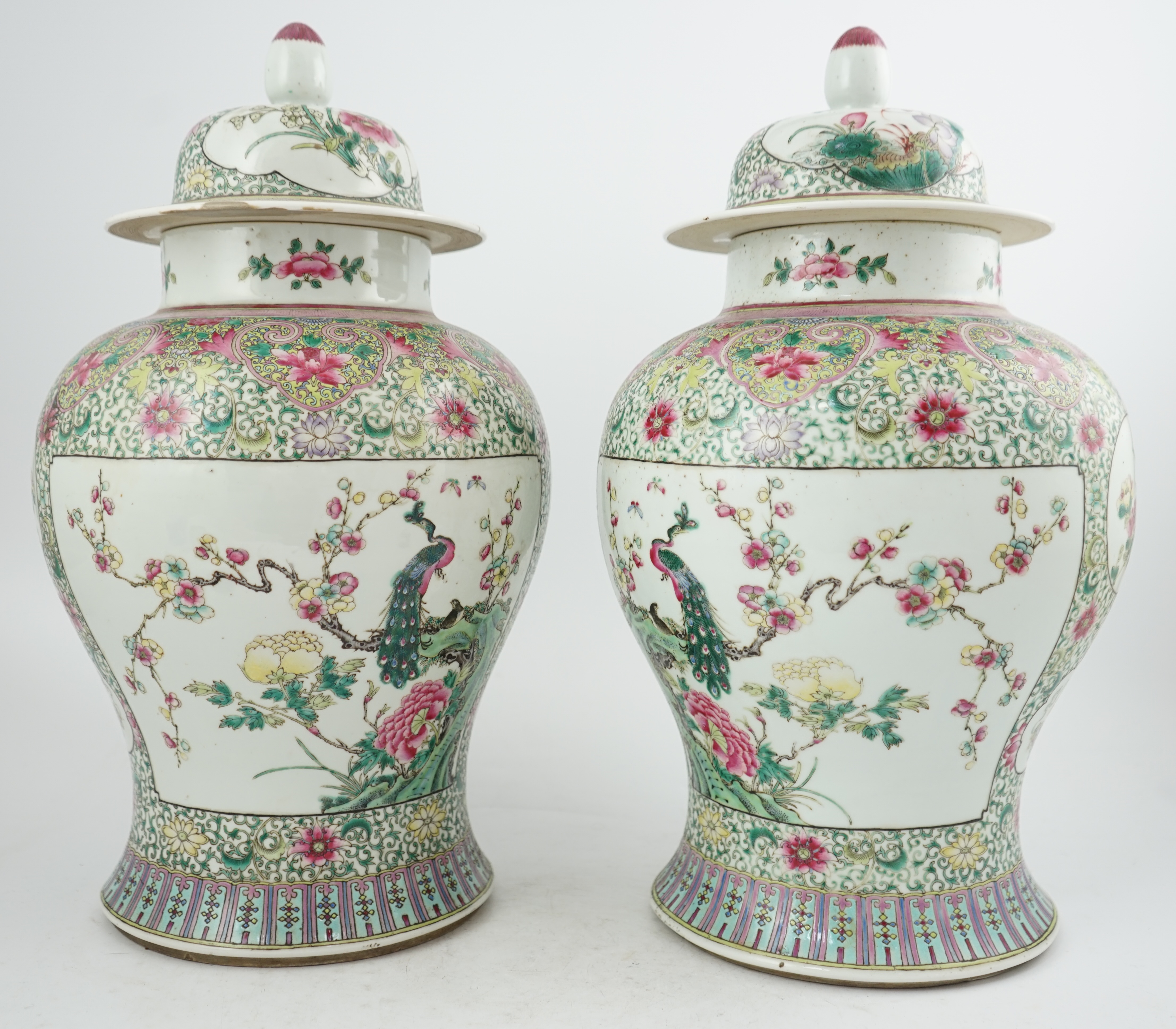 A pair of large Chinese famille rose baluster jars and covers, Qianlong seal mark, but late 19th century